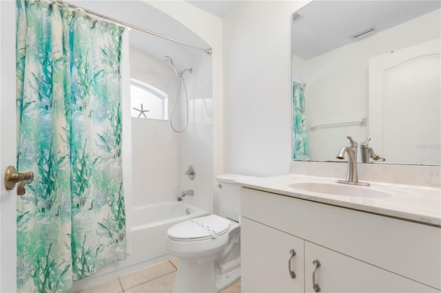 full bathroom with toilet, tile patterned floors, vanity, and shower / tub combo with curtain