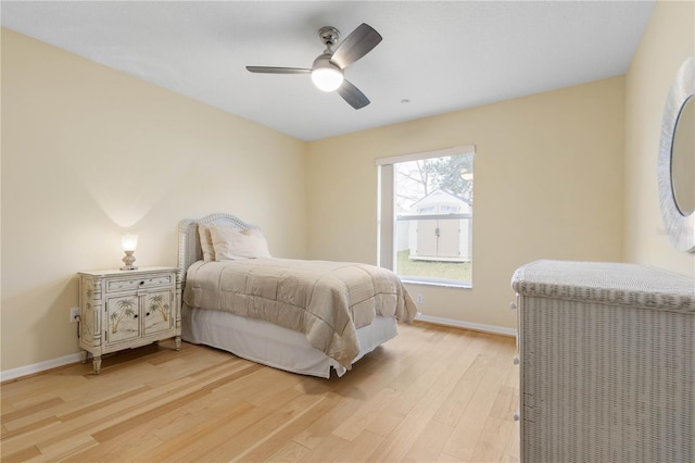 bedroom with ceiling fan and light wood-type flooring