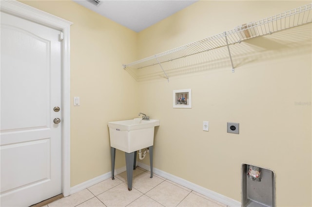 washroom with light tile patterned floors, washer hookup, and electric dryer hookup