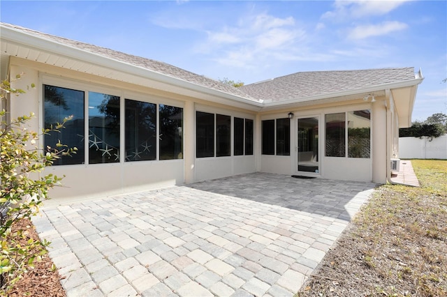 rear view of property featuring a patio