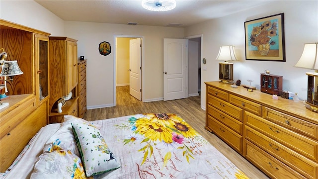 bedroom featuring light hardwood / wood-style flooring