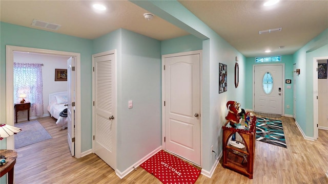 foyer with light hardwood / wood-style floors