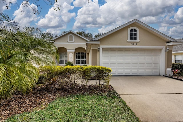 ranch-style house featuring a garage