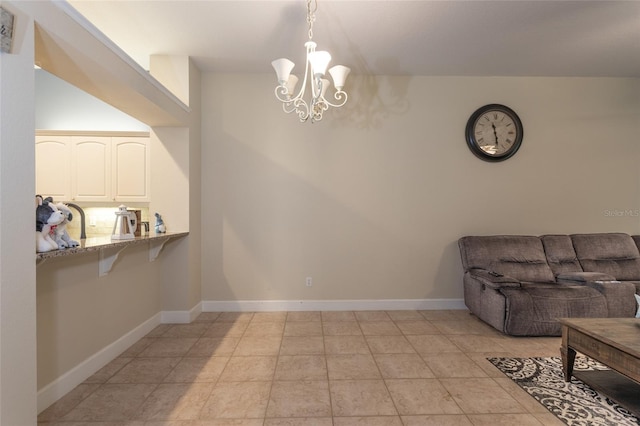 dining space with light tile patterned floors and a notable chandelier