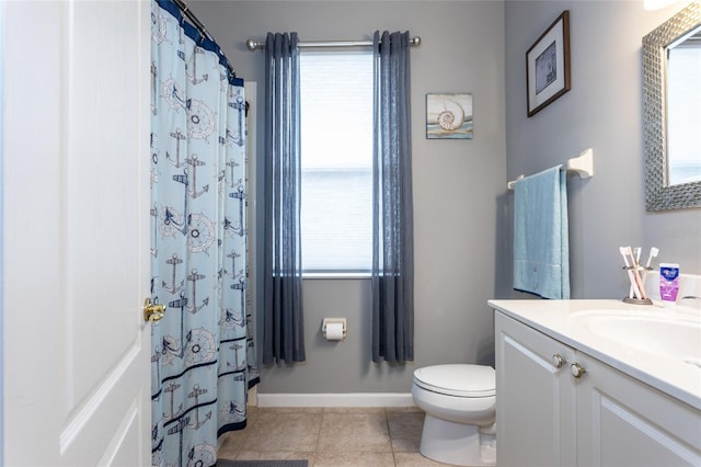 bathroom featuring toilet, vanity, and tile patterned flooring