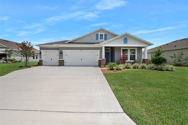 craftsman-style home featuring a front lawn and a garage