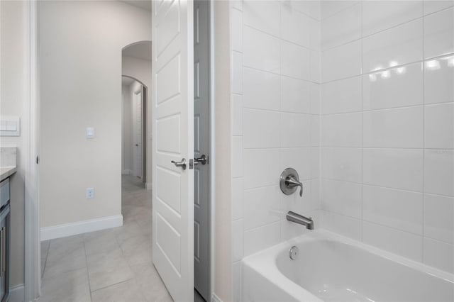 bathroom with shower / washtub combination, tile patterned floors, and vanity