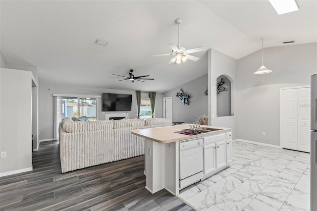 kitchen featuring white cabinetry, hanging light fixtures, vaulted ceiling, white dishwasher, and a center island with sink