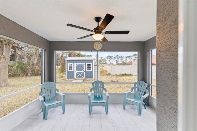 sunroom featuring plenty of natural light and ceiling fan