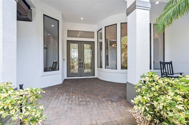 view of exterior entry featuring french doors