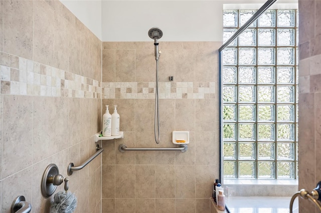 bathroom with tiled shower