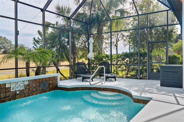 view of swimming pool featuring a patio and glass enclosure