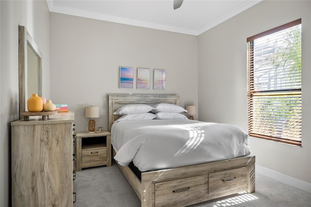 bedroom with ceiling fan, ornamental molding, and light carpet