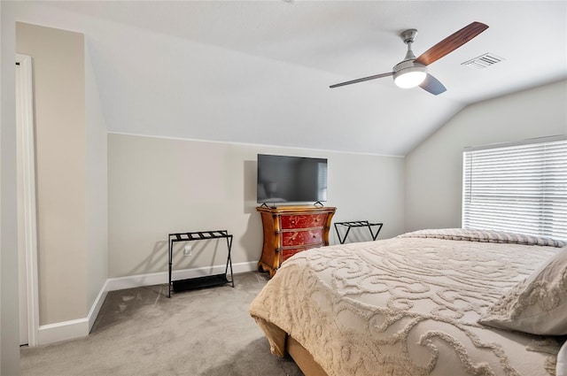 bedroom featuring vaulted ceiling, ceiling fan, and light colored carpet