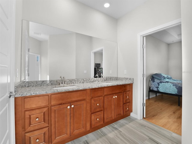 bathroom with vanity and hardwood / wood-style floors