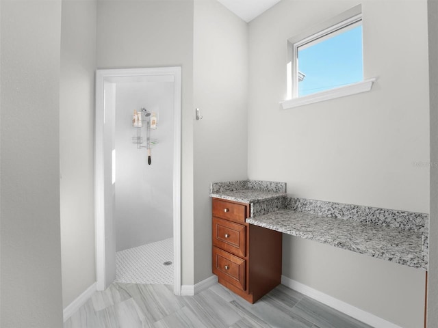 bathroom featuring a tile shower