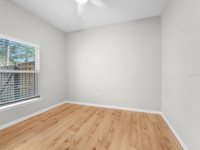 spare room featuring hardwood / wood-style flooring and ceiling fan