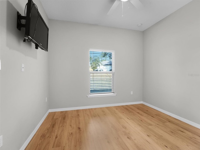 unfurnished room featuring hardwood / wood-style flooring and ceiling fan