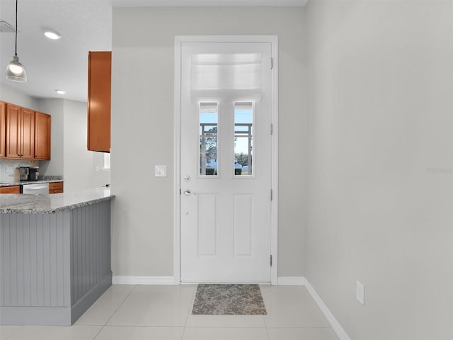 doorway to outside featuring light tile patterned floors