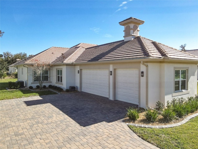 ranch-style home featuring a garage