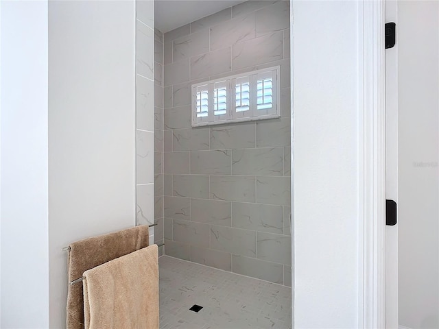 bathroom with tiled shower