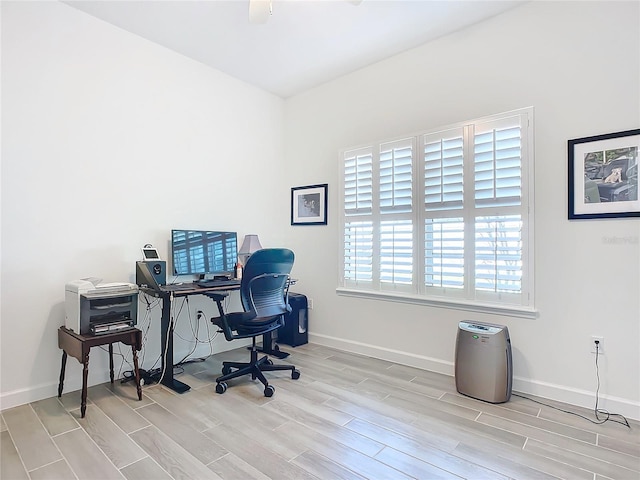 office space featuring ceiling fan and light wood-type flooring