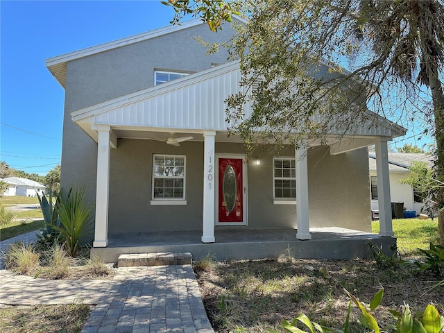 view of front of home with ceiling fan and a porch