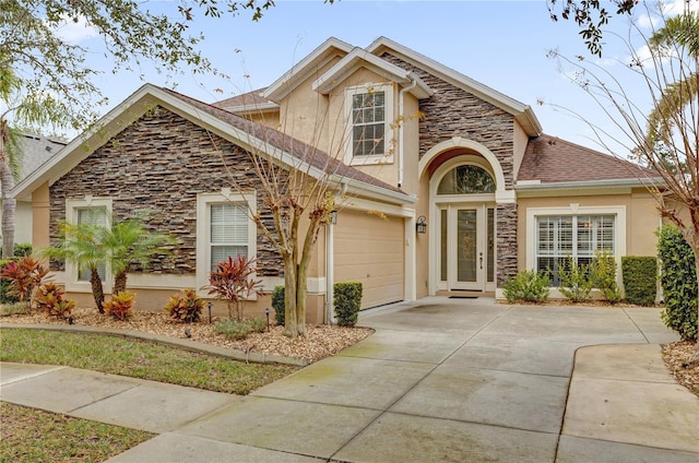 view of front of property with a garage