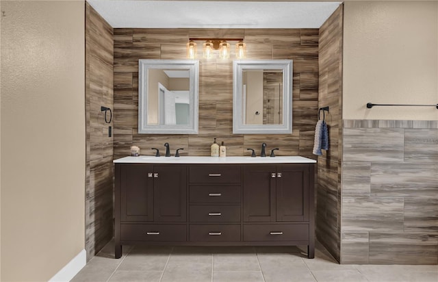 bathroom featuring vanity, tile patterned flooring, and tile walls