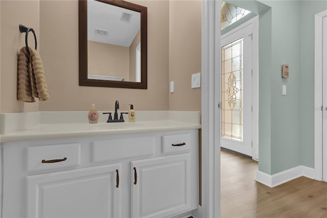 bathroom with wood-type flooring and vanity