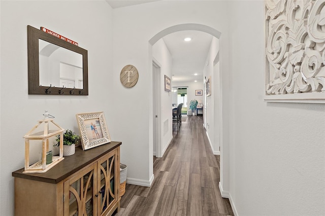 hallway featuring dark hardwood / wood-style flooring