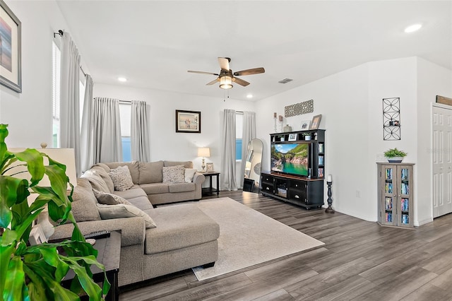 living room featuring ceiling fan and hardwood / wood-style floors