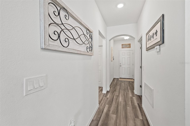 corridor featuring hardwood / wood-style floors