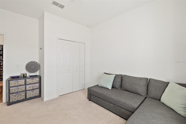 living room featuring light colored carpet