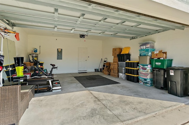 garage featuring a garage door opener and electric panel