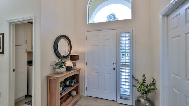 entryway with light tile patterned floors