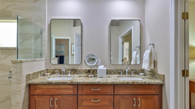 bathroom with a shower and vanity