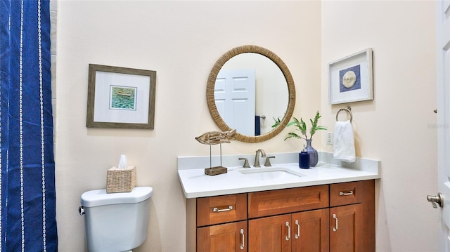 bathroom with toilet and vanity