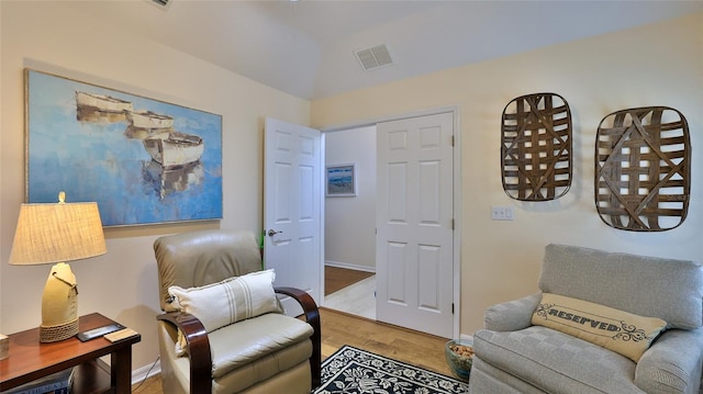 living area featuring hardwood / wood-style floors