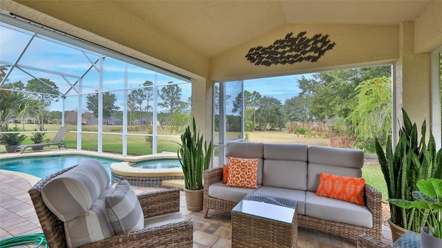 sunroom with vaulted ceiling and a pool