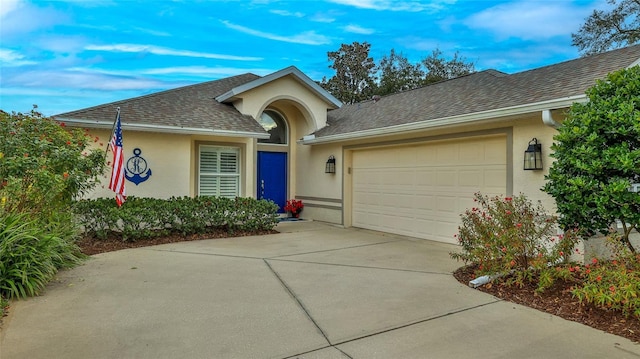 ranch-style house featuring a garage