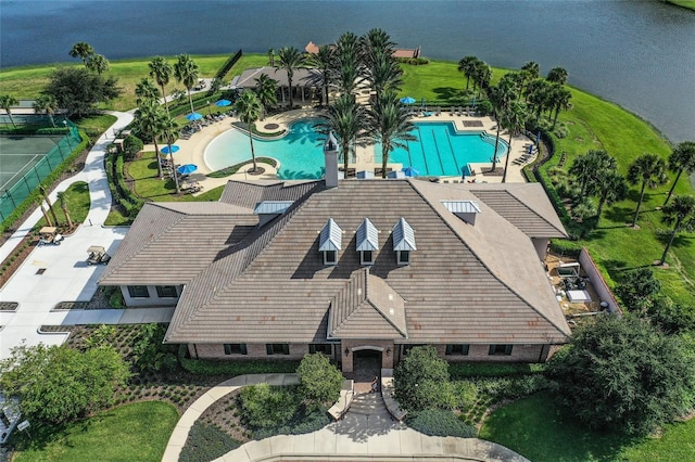 birds eye view of property with a water view