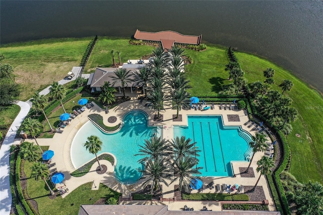 birds eye view of property with a water view