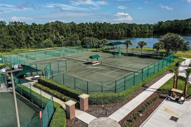 view of sport court with a water view