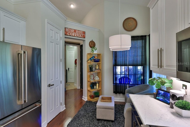 living room featuring vaulted ceiling and dark hardwood / wood-style flooring