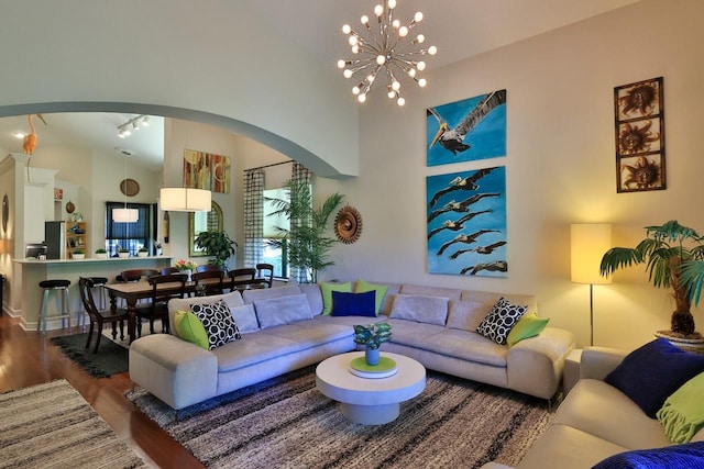 living room featuring a chandelier and hardwood / wood-style floors