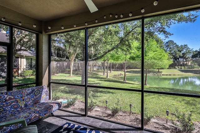 unfurnished sunroom with a water view