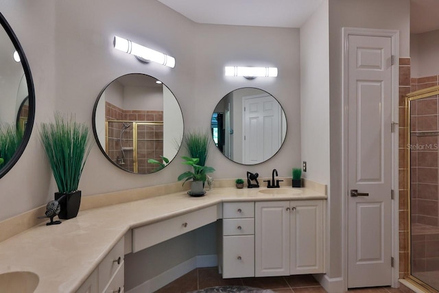 bathroom with vanity, tile patterned floors, and walk in shower