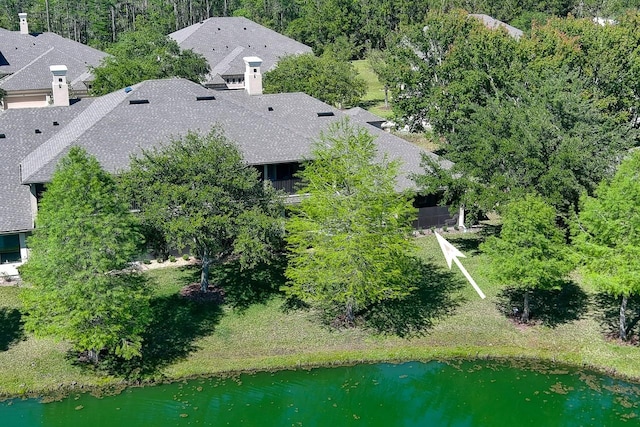 birds eye view of property featuring a water view