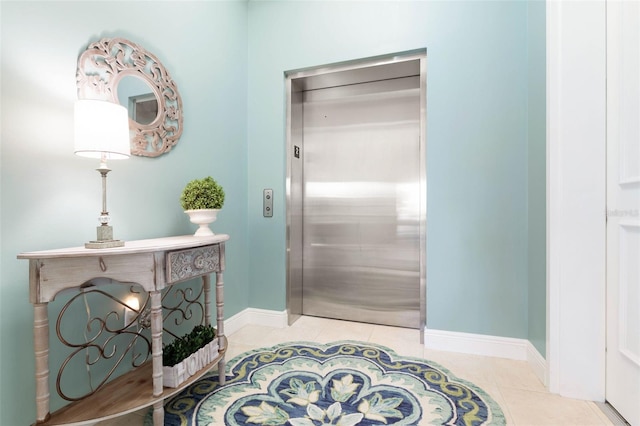 bathroom with tile patterned flooring and elevator